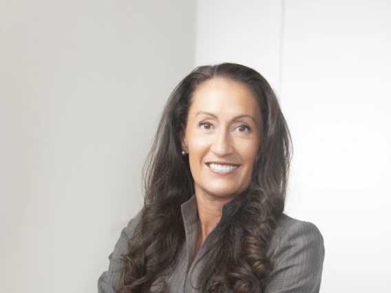 Kris Wong Davis in Gray Suit with Arms Crossed
