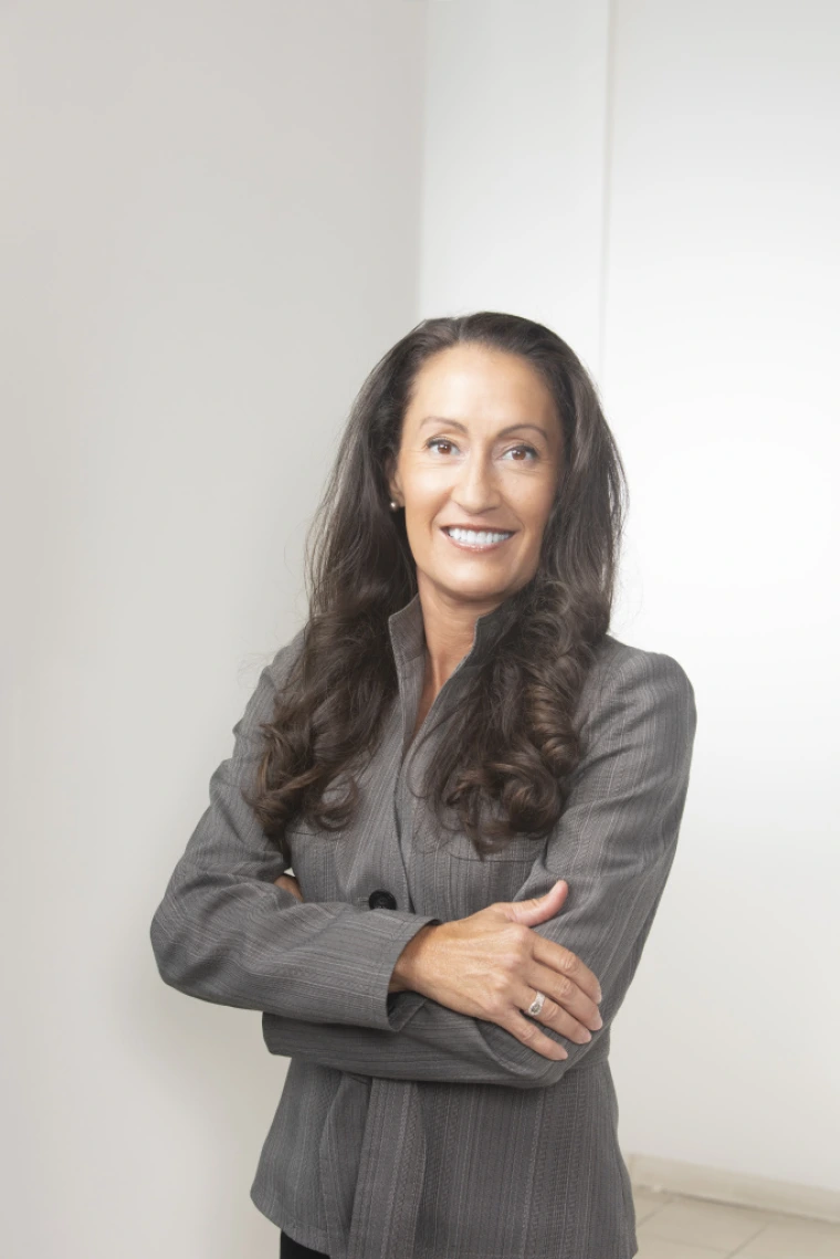 Kris Wong Davis in Gray Suit with Arms Crossed